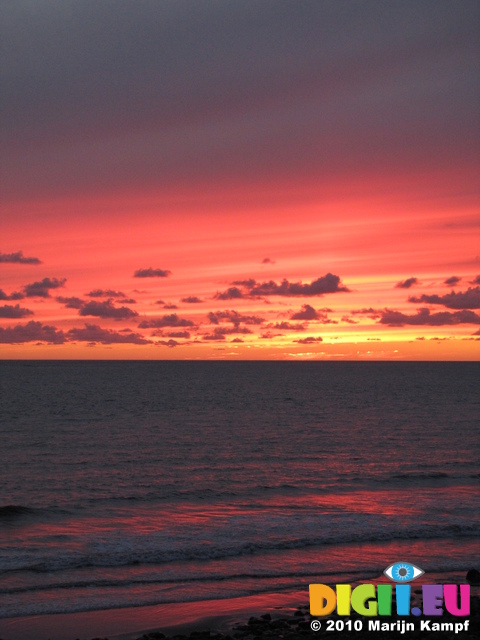 SX16495 Red sky from sunset over sea at Ogmore by Sea